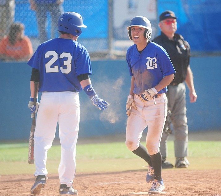Bagdad's Israel Loveall congratulates Benjamin Loveall on his triple scoring as the Sultans take on the Chino Valley on March 17 in Chino Valley. Benjamin Loveall had two hits and three RBIs in a 23-0 win over Salome on Tuesday, March 28. (Les Stukenberg/Courier, File)