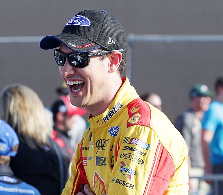 Joey Logano waits to qualify for Sunday's NASCAR Cup Series auto race, Friday, March 17, in Avondale, Ariz.