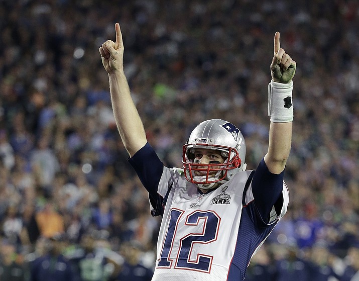 In this Feb. 1, 2015, file photo, New England Patriots quarterback Tom Brady (12) celebrates during the second half of NFL Super Bowl XLIX football game against the Seattle Seahawks in Glendale, Ariz. Brady's missing jersey from the Super Bowl has been found in the possession of a member of the international media. The NFL said in a statement Monday, March 20, 2017, that his jersey was found through the "cooperation of the NFL and New England Patriots' security teams, the FBI and other law enforcement authorities." Brady said his jersey went missing after the Patriots' 34-28 win last month over the Atlanta Falcons.  The statement also said an ongoing investigation retrieved the jersey Brady wore in the Patriots' 2015 Super Bowl win against the Seahawks. (Kathy Willens/AP, File)