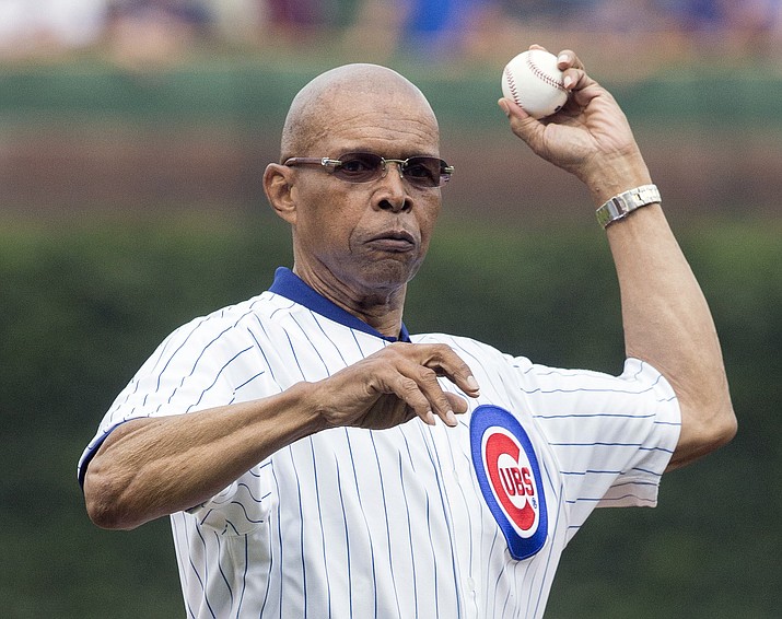 Former Chicago Bear Gale Sayers throws out a ceremonial first pitch before a baseball game between the Chicago Cubs and Atlanta Braves on July 11, 2014, in Chicago. (Andrew A. Nelles/AP)
