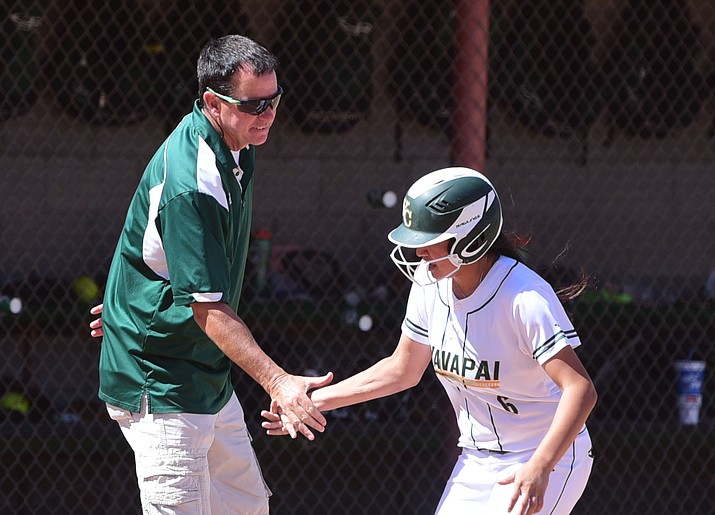 Yavapai College head coach Doug Eastman congratulates Andrea Sotelo on her home run as the Roughriders take on South Mountain on March 18 in Prescott. Sotelo hit three home runs, two in the first game of a doubleheader against Phoenix College on Tuesday afternoon. (Les Stukenberg/Courier, File)