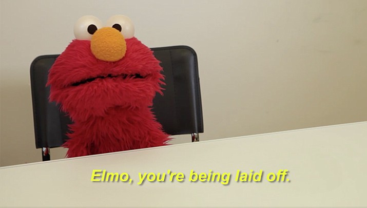 The video shows an unseen man delivering the news to Elmo in a nondescript room. Elmo doesn't take the news well.