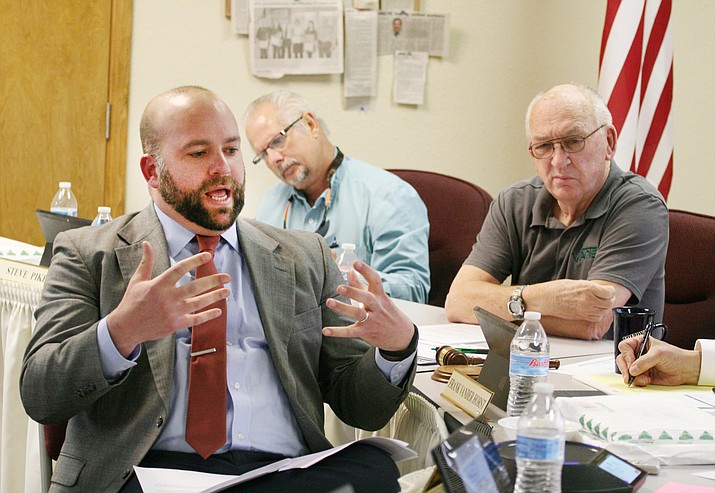 Michael Lauzon, CPA with Heinfeld Meech and Company, discusses the draft of an audit he performed on the Valley Academy of Career and Technical Education at the monthly V’ACTE governing board meeting. (Photo by Bill Helm)