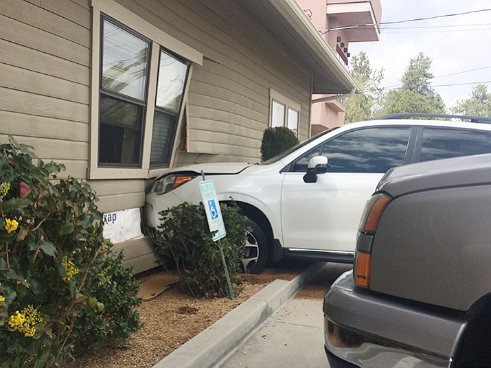 A woman allegedly crashed into the wall of an office building on Gurley Street in Prescott on Thursday, March 23.