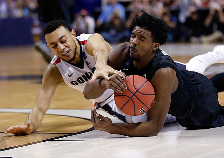 Xavier guard Quentin Goodin, right, grabs a loose ball next to Gonzaga guard Nigel Williams-Goss during the first half of an NCAA Tournament college basketball regional final game Saturday, March 25, 2017, in San Jose, Calif.

