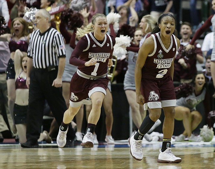 Mississippi State guard Morgan William (2) celebrates after she hit the winning shot in overtime to defeat Connecticut in an NCAA college basketball game in the semifinals of the women's Final Four, Friday, March 31, 2017, in Dallas. Mississippi State won 66-64. (AP Photo/LM Otero)