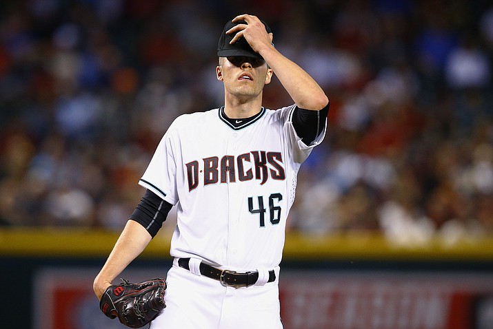 Arizona Diamondbacks’ Patrick Corbin pauses on the mound after giving up a bloop two-run single to San Francisco Giants’ Gorkys Hernandez during the second inning Tuesday, April 4, in Phoenix. The Giants defeated the Diamondbacks 8-4. (Ross D. Franklin/AP)