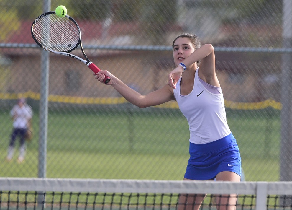 Prescott's Anna Miller hits a return shot as the Lady Badgers take on Goldwater Wednesday, April 5 in Prescott  (Les Stukenberg/The Daily Courier)