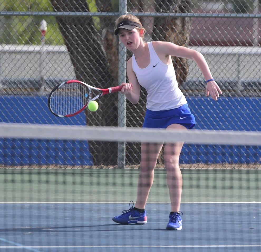 Prescott's Sarah Jane Schott hits a return shot as the Lady Badgers take on Goldwater Wednesday, April 5 in Prescott  (Les Stukenberg/The Daily Courier)