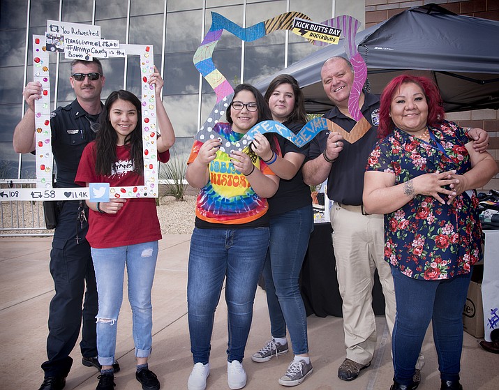 Youth coalition members were supported by Wiinslow Police. Lt. Arend and Officer Havalicek at Kick Butts Day March 30 in Winslow. Photo/Todd Roth