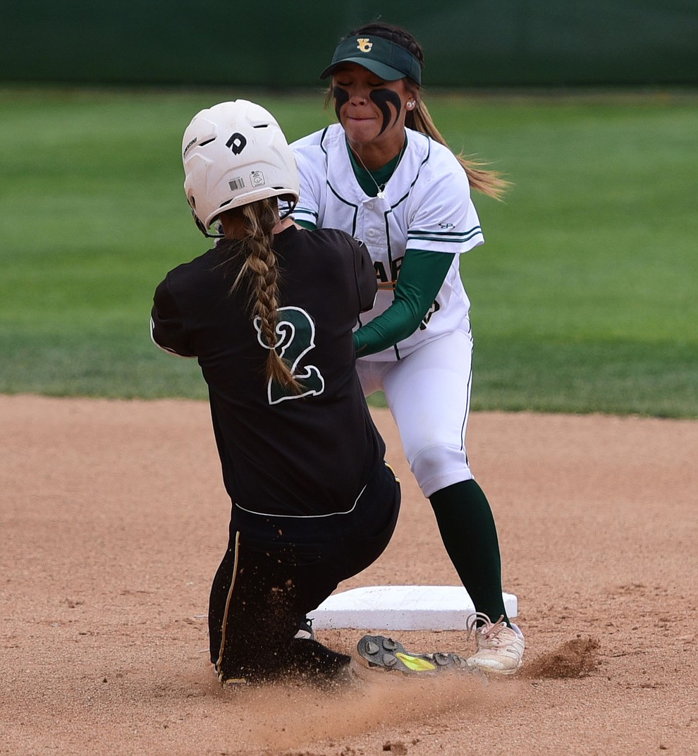 Yavapai's Shayna Ige tags out a stealing Brianna Moeller at second base as the Lady Roughriders play Central Arizona in softball Saturday, April 8 in Prescott.  (Les Stukenberg/Courier)