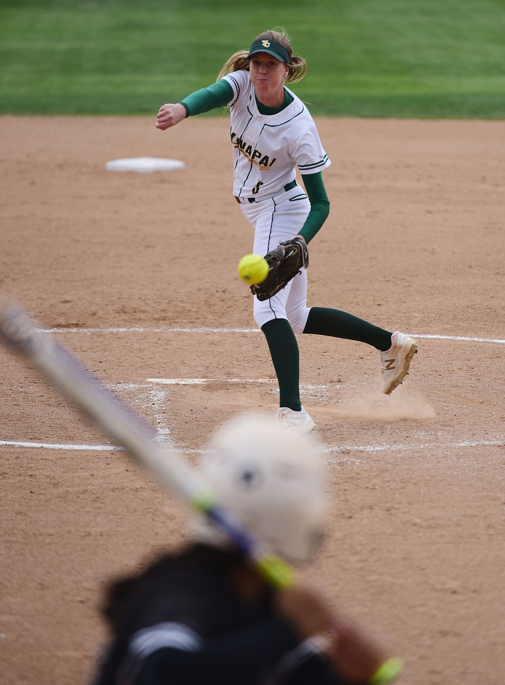 Yavapai's Amy Robinson delivers a pitch  as the Lady Roughriders play Central Arizona in softball Saturday, April 8 in Prescott.  (Les Stukenberg/Courier)