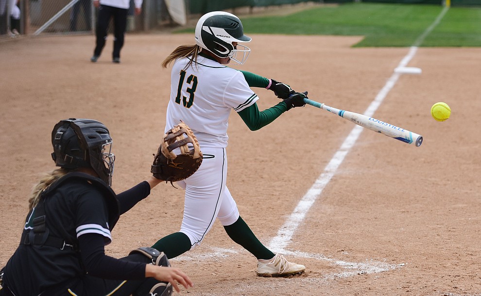 Yavapai's Shayna Ige makes contact as the Lady Roughriders play Central Arizona in softball Saturday, April 8 in Prescott.  (Les Stukenberg/Courier)
