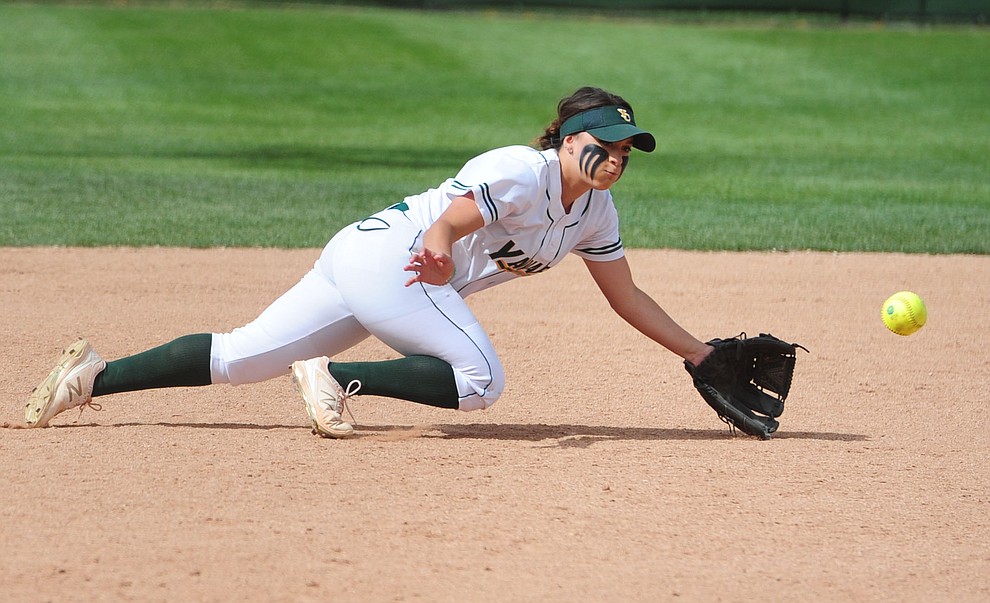 Yavapai's Karissa Pena dives to the ball as the Lady Roughriders play Central Arizona in softball Saturday, April 8 in Prescott.  (Les Stukenberg/Courier)