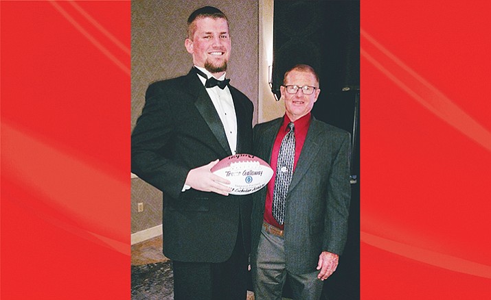 Mingus Union senior Trevor Galloway and Marauder head football coach Bob Young pose for a photo at the National Football Foundation Valley of the Sun Chapter 36th annual scholar awards banquet in Scottsdale on Saturday. The NFF honored 33 athletes from metropolitan Phoenix and Northern Arizona and Galloway was selected to the second team. (Photo courtesy Wayne Galloway)