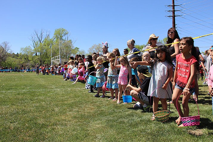 Children wait anxiously to rush Mile High Middle School’s athletic field in Prescott so they may collect Easter eggs during the fifth annual Great Prescott Easter Egg Hunt on Saturday, April 15. 