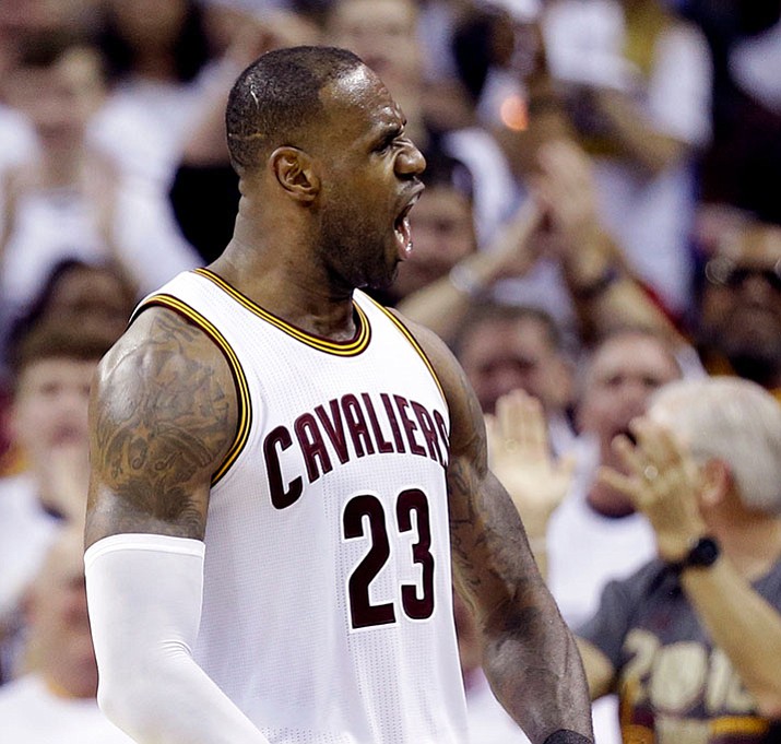 Cavaliers' LeBron James reacts after scoring in the second half in Game 1 of a first-round NBA basketball playoff series against the Indiana Pacers Saturday, April 15, in Cleveland.