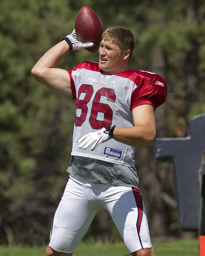 In this Aug. 4, 2011 file photo, Arizona Cardinals’ Todd Heap warms up at NFL football training camp in Flagstaff, Ariz. 