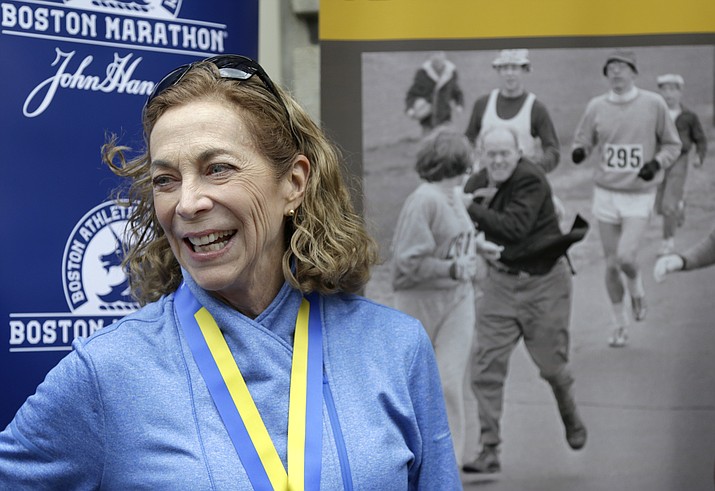 Kathrine Switzer, the first official woman entrant in the Boston Marathon 50 years ago, laughs during a news conference Tuesday, April 18, in Boston, where her bib No. 261 was retired in her honor by the Boston Athletic Association. (Elise Amendola/AP)