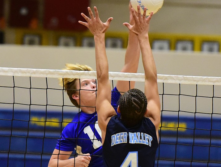 Prescott’s Tate Bassett goes for a kill as the Badgers take on Deer Valley in boys volleyball Thursday in Prescott. (Les Stukenberg/Courier)