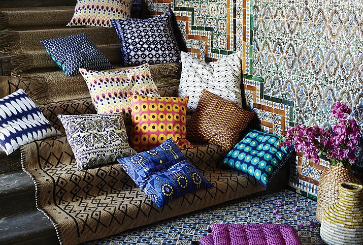 This 2016 photo provided by IKEA shows some of IKEA's new eclectic JASSA collection which includes pottery, colorful fabrics and furnishings made from natural materials, with a mix of modern and traditional craft techniques. (Inter IKEA Systems B.V. 2016 via AP)