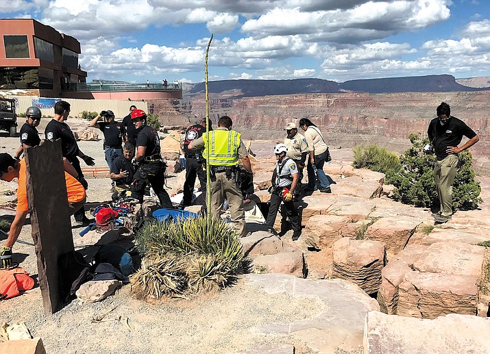 MCSO Search and Rescue, along with DPS and Grand Canyon West Fire Department personnel, work to free a woman who fell 50 feet down a crevice.