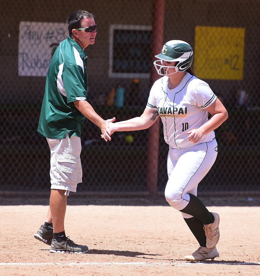 Yavapai's Jaydee Boursaw gets congratulated by Head Coach Doug Eastman after hitting a three-run homer as they faced Scottsdale Community College Saturday, April 22 in Prescott.