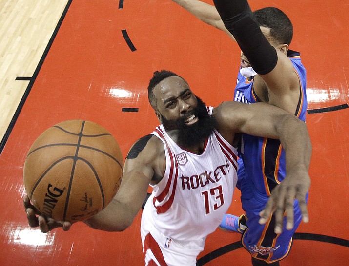 Houston Rockets' James Harden (13) goes up for a shot as Oklahoma City Thunder's Andre Roberson defends during the first half in Game 5 of an NBA basketball first-round playoff series Tuesday, April 25, in Houston. (David J. Phillip/AP)