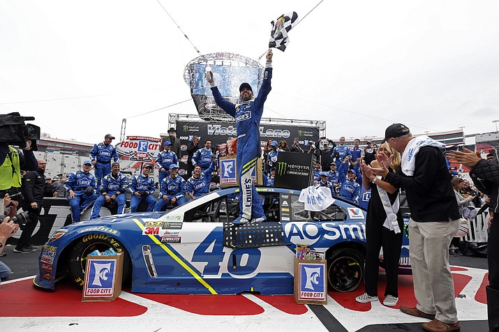 Driver Jimmie Johnson (48) celebrates after winning a NASCAR Monster Energy NASCAR Cup Series auto race, Monday in Bristol, Tenn. The race was originally scheduled for Sunday, but rain forced the Monday start. (Wade Payne/AP)