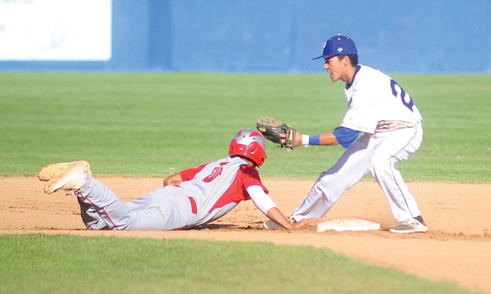 Prescott’s Raymundo Chairez tries to tag out a Mingus Union’s Jose Pacheco as the Badgers take on Mingus in varsity baseball Tuesday, April 25 in Prescott.  (Les Stukenberg/Courier)