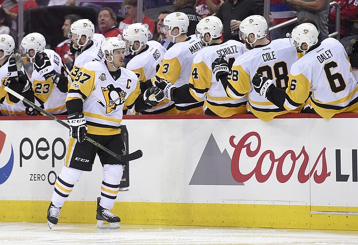 Pittsburgh Penguins center Sidney Crosby (87) celebrates his goal with the bench during the second period of Game 1 of the team's NHL hockey Stanley Cup second-round playoff series against the Washington Capitals on Thursday, April 27, in Washington. (Nick Wass/AP)
