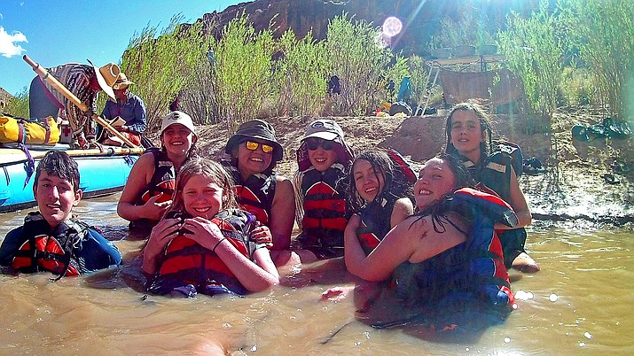 Students play around in the San Juan River after a day of rafting.
