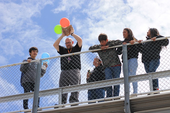 Williams High School science teacher Michael Lee pitches student’s packaged raw eggs off the football bleachers April 26.