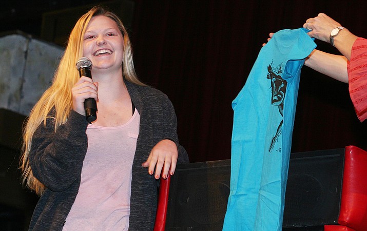 Mingus Union senior Carrington Midkiff designed the logo on the t-shirt presented to each of the school’s 273 Strive for .5 students at Tuesday’s ceremony in the school’s auditorium. (Photo by Bill Helm)