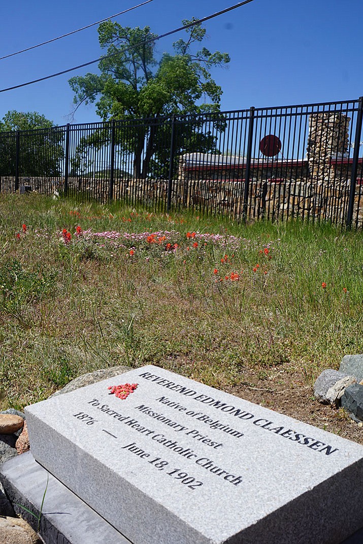 A new headstone has been laid at the gravesite of Father Edmund Claessen, a Sacred Heart Church priest from the early 1900s. Claessen died of typhoid fever in 1902 at the age of 26. (Cindy Barks/Courier)