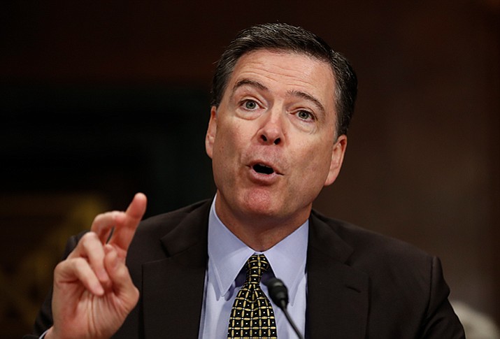 President Donald Trump abruptly fired FBI Director James Comey on Tuesday, ousting him while that agency conducts an investigation into the Trump’s campaign ties to Russian interference during the election. (Carolyn Kaster/AP file)