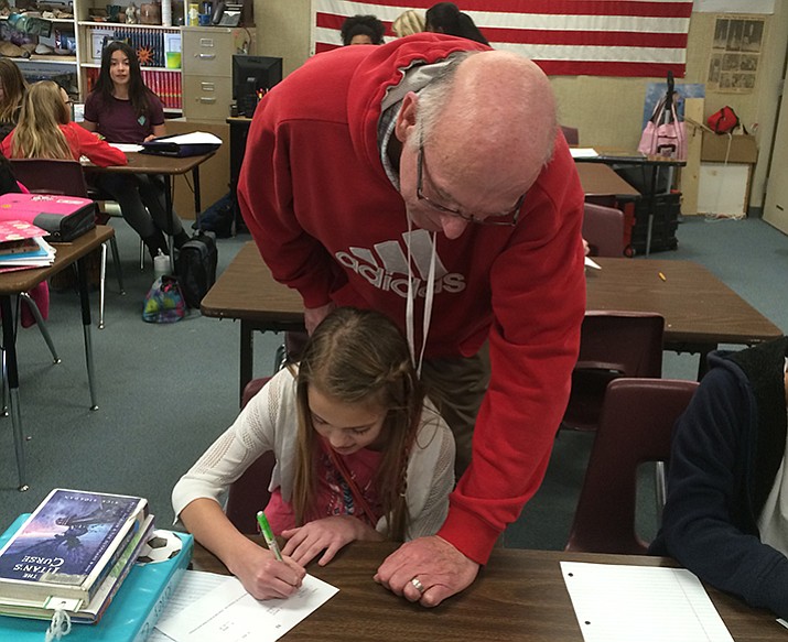 Teacher, Michael McCrady working with one of his students. (Nanci Hutson/Courier)