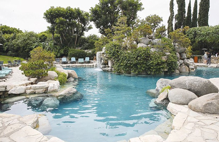 An area of the grounds at the Playboy Mansion in Los Angeles is pictured. The Playboy Mansion was among the priciest homes to sell in 2016. Global luxury home sales cooled off in 2016 for the second year in a row, even as a record number of homes sold for more than $100 million, a new report shows. (Photo by John Salangsang/Invision/AP, File)