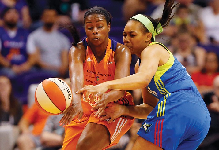 Phoenix Mercury forward Camille Little (20) steals the ball from Dallas Wings guard Allisha Gray (15) during a WNBA basketball game in Phoenix, Sunday, May 14, 2017. (Michael Chow/The Arizona Republic via AP)