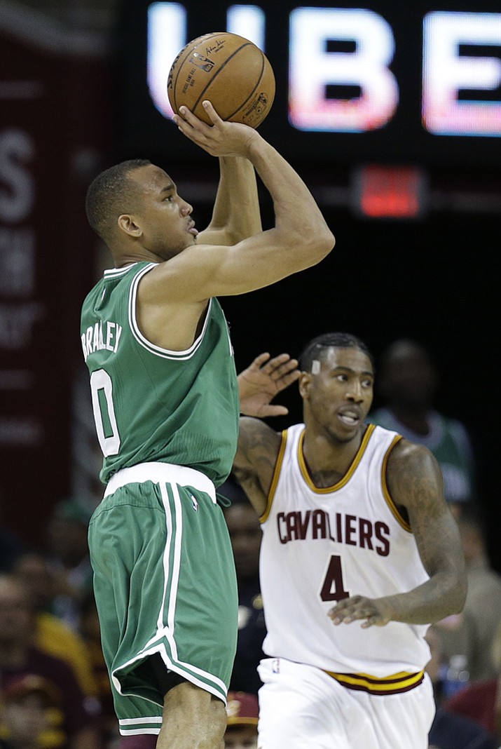 Boston Celtics' Avery Bradley shoots over Cleveland Cavaliers' Iman Shumpert during the second half of Game 3 of the NBA basketball Eastern Conference finals, Sunday, May 21, in Cleveland. 