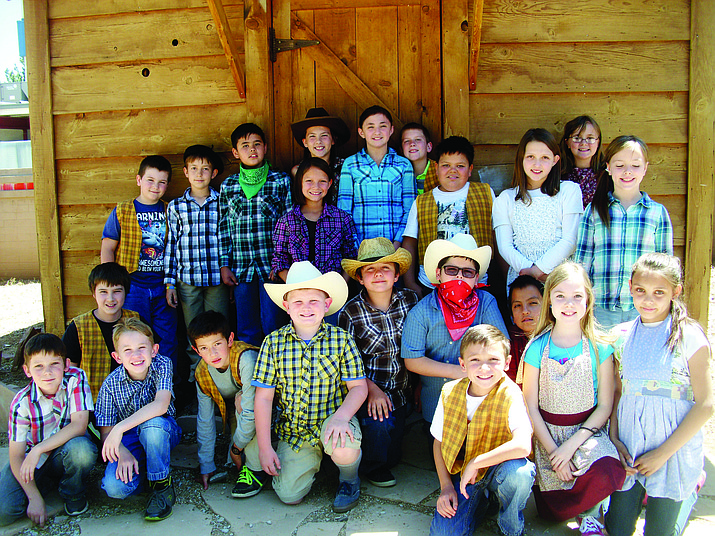 Del Rio School experienced a time warp May 11 as fourth-graders participated in Arizona History Day with activities such as butter churning and weaving, visits to the onsite Hogan, branding real cowhide, stick horse barrel racing, a campfire picnic and traditional cowboy songs with live bands. This was an unforgettable learning experience about Arizona history.