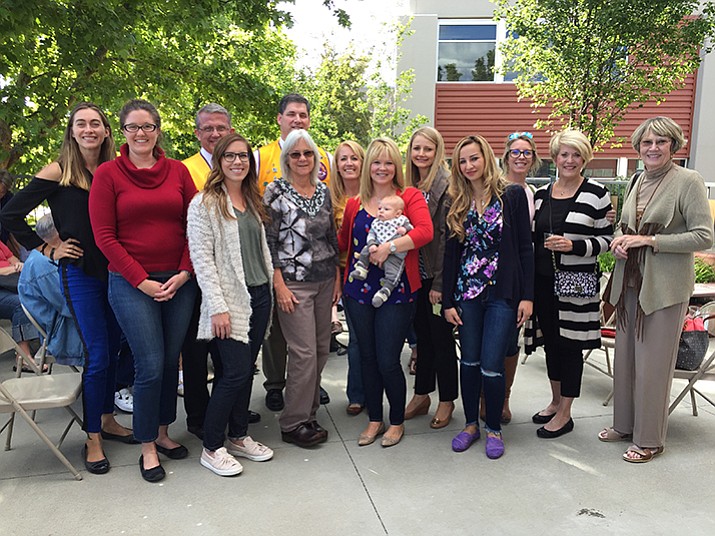 The Friends of the Family Enrichment Center pose with representatives from the Prescott Sunrise Lions at the annual open house on May 18.  (Courtesy)
