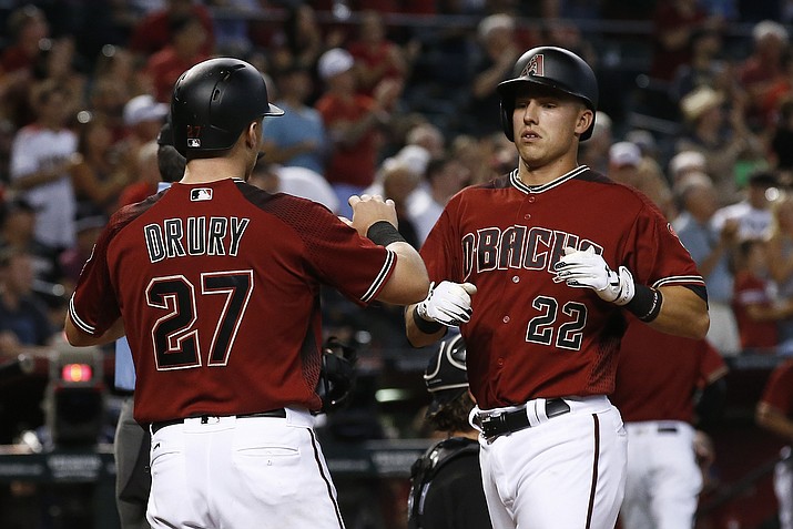 Arizona Diamondbacks’ Jake Lamb (22) celebrates his two-run home run against the Chicago White Sox with Brandon Drury (27) during the fifth inning Wednesday, May 24, 2017, in Phoenix. (Ross D. Franklin/AP)