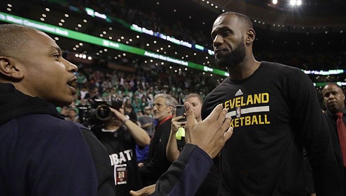 Boston Celtics guard Isaiah Thomas, left, and Cleveland Cavaliers forward LeBron James speak after Game 5 of the NBA basketball Eastern Conference finals, on Thursday, May 25, in Boston. The Cavaliers won 135-102.