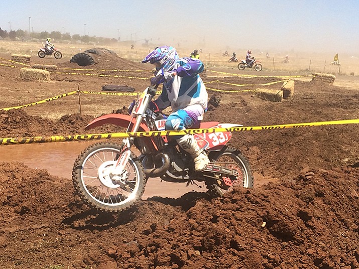 A rider in the Big Bike heat maneuvers around a mud pit at the Prescott Valley Grand Prix on Saturday, May 27, at the Prescott Valley Event Center. Racing continues today. (Jason Wheeler/Courier)