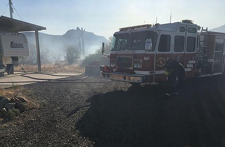 An unidentified fire truck parks near a wildfire burning on the northeast side of Black Canyon City. (InciWeb/Courtesy)