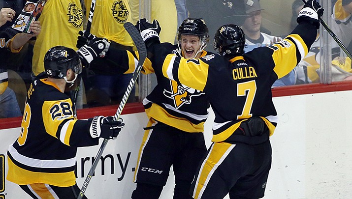 Pittsburgh Penguins’ Jake Guentzel, center, celebrates his goal against the Nashville Predators with Ian Cole, left, and Matt Cullen during the third period in Game 1 of the NHL Stanley Cup Finals on Monday, May 29, 2017, in Pittsburgh. 