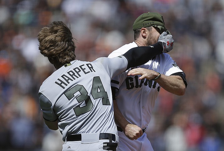 Washington Nationals’ Bryce Harper (34) hits San Francisco Giants’ Hunter Strickland in the face after being hit with a pitch in the eighth inning Monday, May 29, 2017, in San Francisco. (Ben Margot/AP)