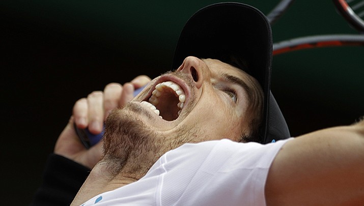 Britain’s Andy Murray serves against Russia’s Karen Khachanov during their fourth-round match of the French Open tennis tournament at the Roland Garros stadium, in Paris, France. Monday, June 5.