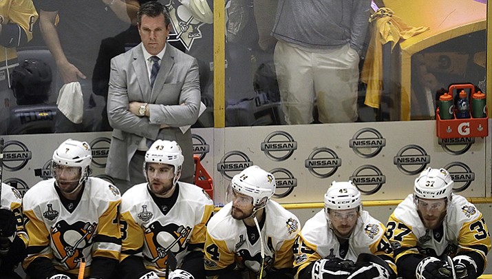 Pittsburgh Penguins head coach Mike Sullivan watches along with his players during the final minutes of the third period in Game 4 of the NHL hockey Stanley Cup Finals against the Nashville Predators Monday, June 5, in Nashville. The Predators won 4-1 to tie the series 2-2.